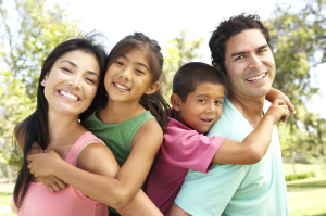 Young Family Having Fun In Park